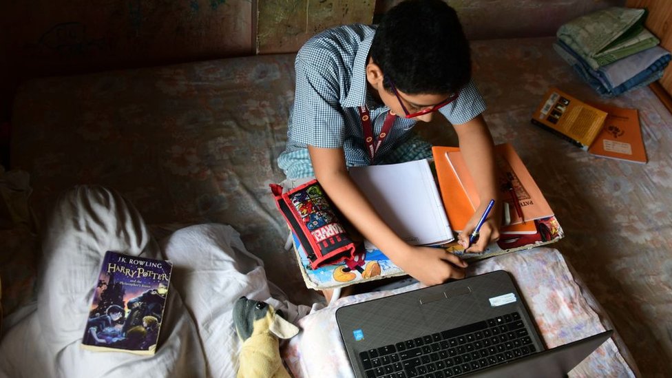 Student takes online classes in India