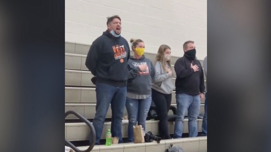 Dad steps in to sing national anthem when it fails to play at son's basketball game