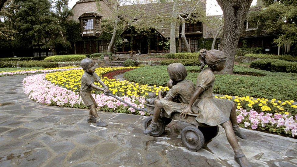 Exterior views of the entrance, house, statues and gardens at Michael Jackson's Neverland Ranch in 1995