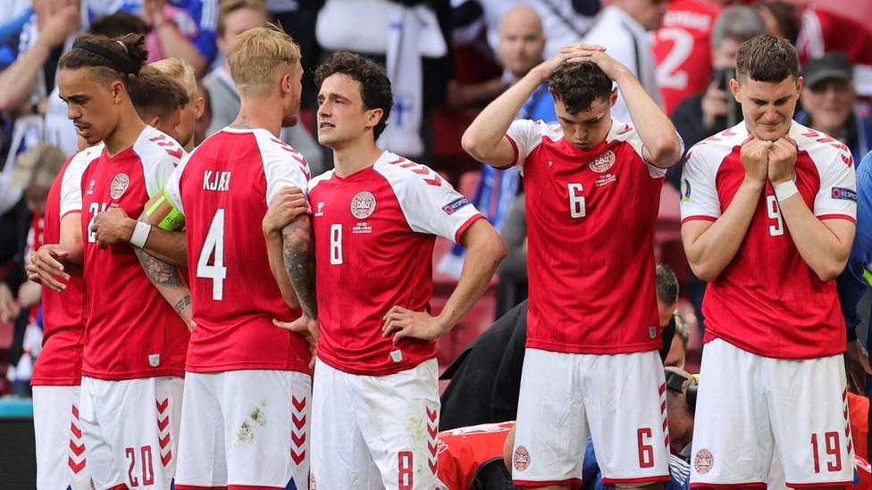 Denmark players react after Christian Eriksen collapses