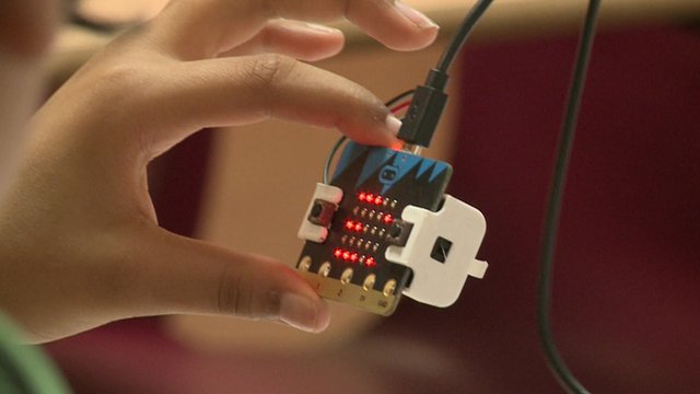 Someone playing with a Micro Bit