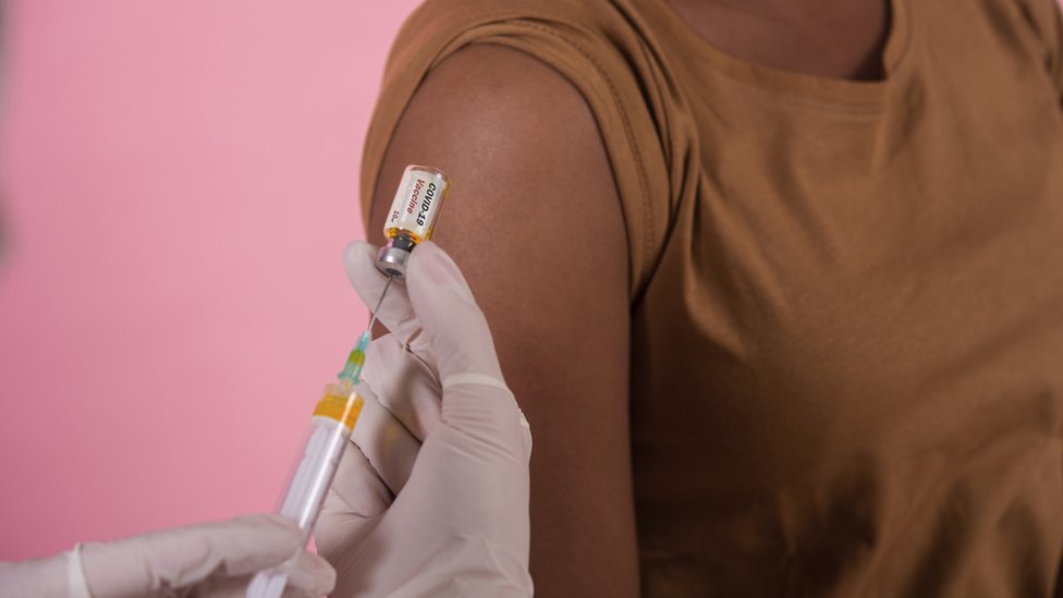 African-American woman getting a Covid vaccine