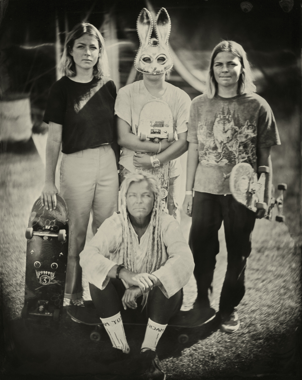Portrait of a group of people with skateboards
