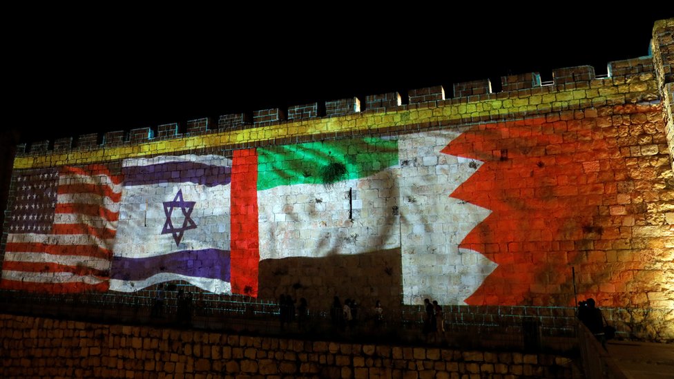 The US, Israeli, UAE and Bahraini flags are projected on to the walls of Jerusalem's Old City on 15 September 2020