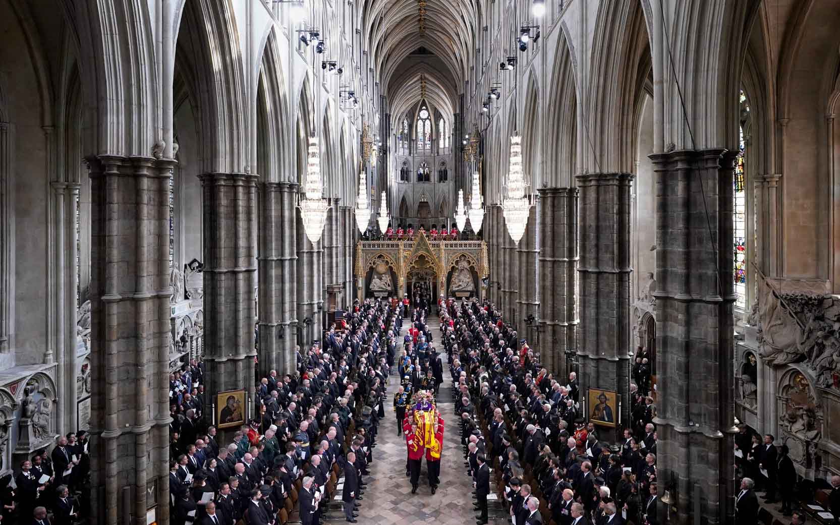 The Queen's coffin is carried through the nave of Westminster Abbey.