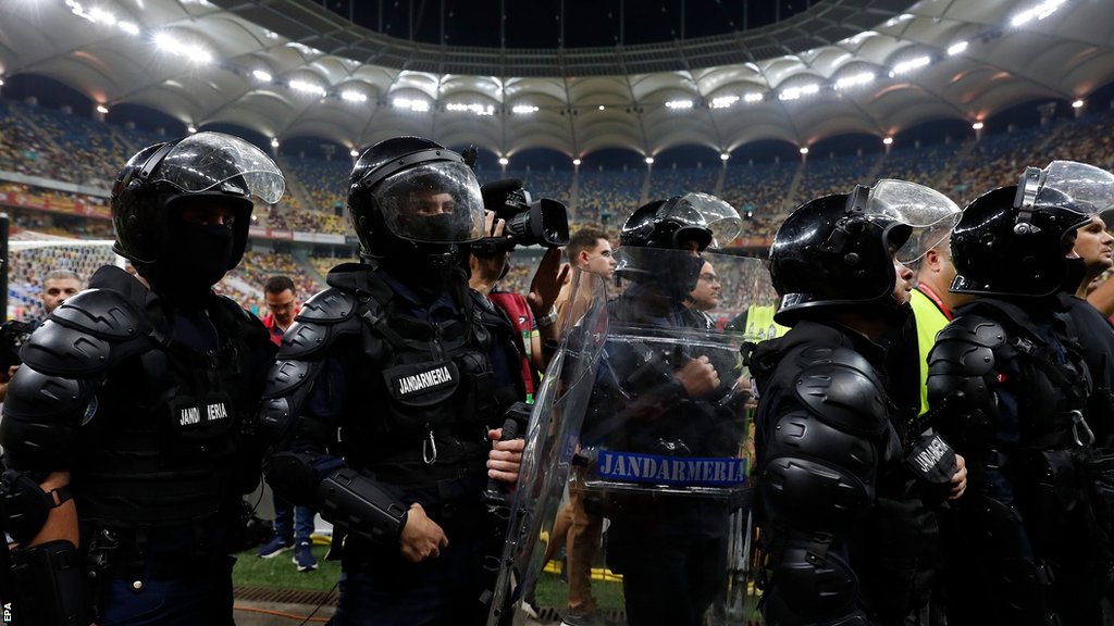 Riot police attempted to speak with the fans leading the chanting at the National Arena in Bucharest