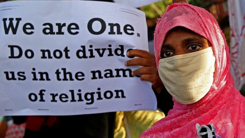 People from different human rights organizations hold placards during a protest against BJP-lead government and Chief Minister of Uttar Pradesh Yogi Adithyanath over the so-called 
