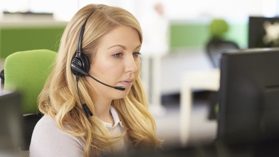 A woman working in a call centre