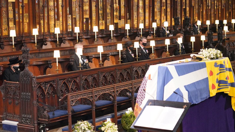 Queen Elizabeth II looks at the coffin of her husband the Duke of Edinburgh at St George's Chapel