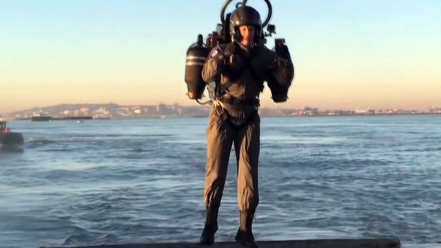 A man flying a jet pack