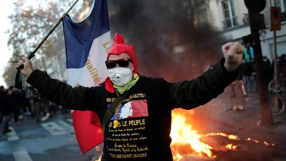 French police fire tear gas at demonstrators as anti-restriction convoy  enters Paris