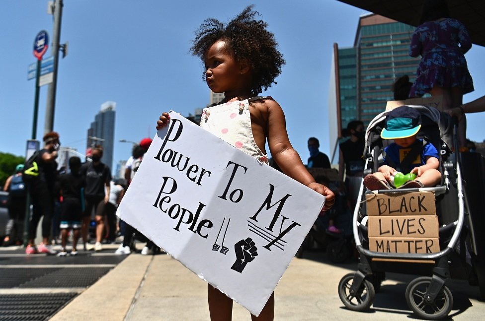 Families participate in a children`s march in solidarity with the Black Lives Matter movement and national protests against police brutality on 9 June 2020 in the Brooklyn Borough of New York City