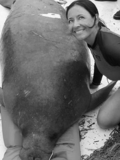 Colombian biologist Nataly Castelblanco poses with a manatee