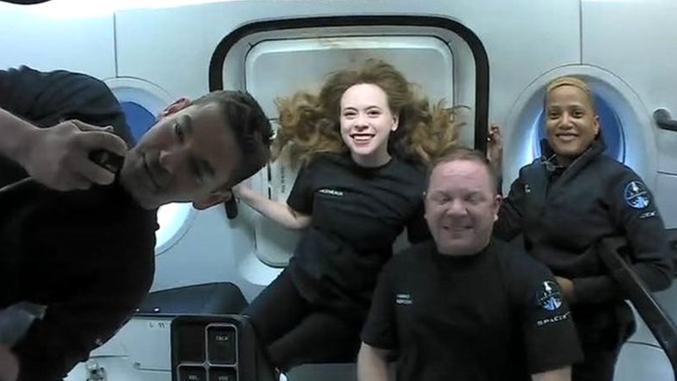 Amateur astronauts Jared Isaacman, Hayley Arceneaux, Sian Proctor and Chris Sembroski in weightless conditions on board the Inspiration4 SpaceX mission