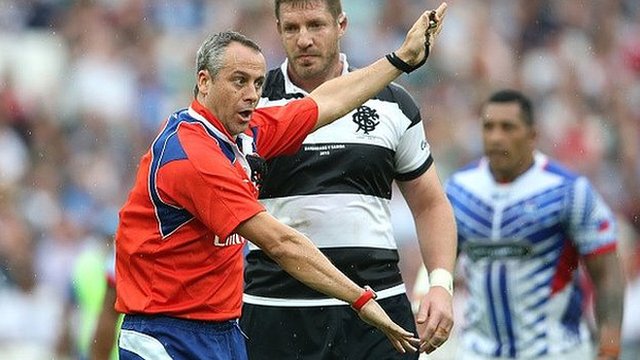 Referee John Lacey issues instructions in a Rugby World Cup warm-up match