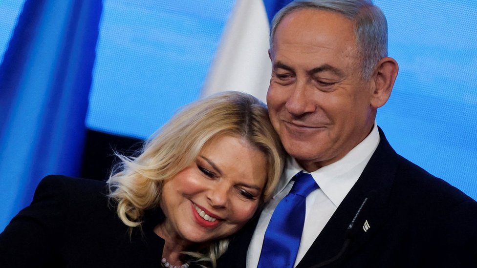 Benjamin Netanyahu hugs his wife Sara as he addresses supporters at his Likud party's election headquarters in Jerusalem on 2 November 2022