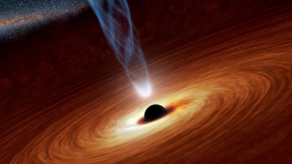 A supermassive black hole with millions to billions times the mass of our sun is seen in an undated NASA artist"s concept illustration