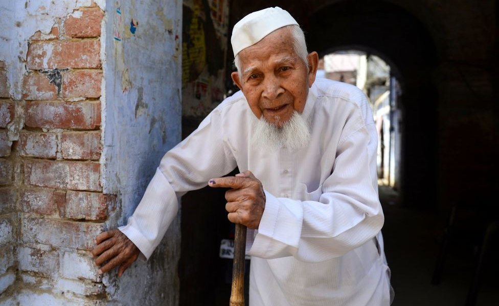 An Indian Muslim voter leaves after casting his vote at a polling station, in Kanpur on April 29, 2019.
