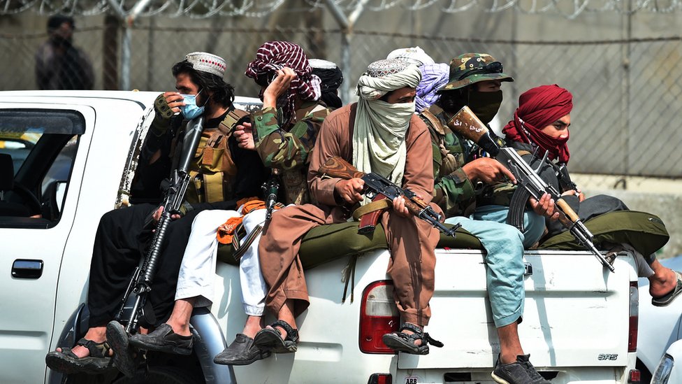 Taliban fighters on guard outside Kabul's aiport