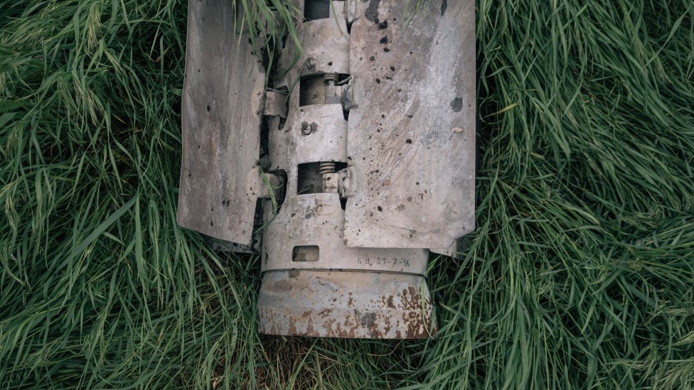 The remains of a rocket that carried cluster munitions found in a field in the countryside of Kherson region
