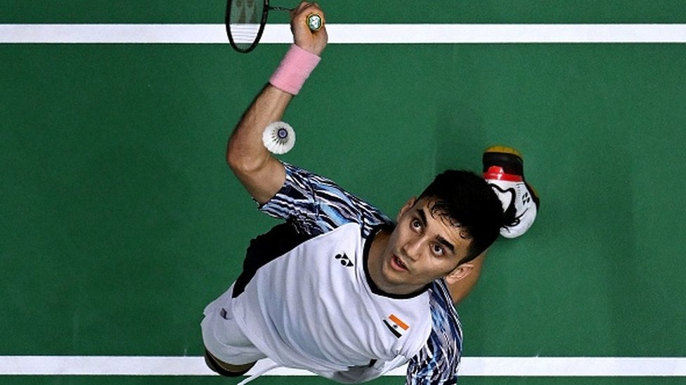 Lakshya Sen hits a return against Indonesia's Anthony Sinsuka Ginting during the men's finals of the Thomas and Uber Cup badminton tournament in Bangkok on May 15, 2022