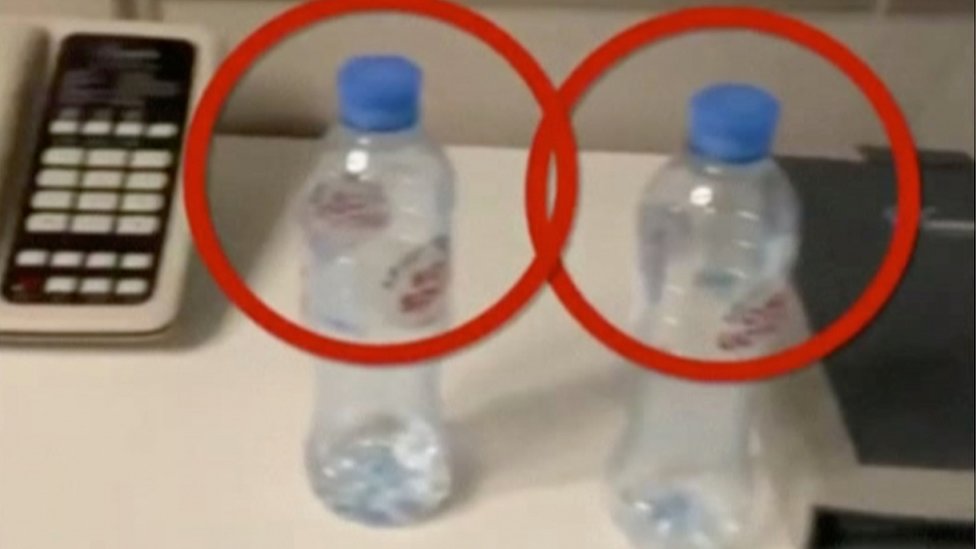 Two empty water bottles are circled in red