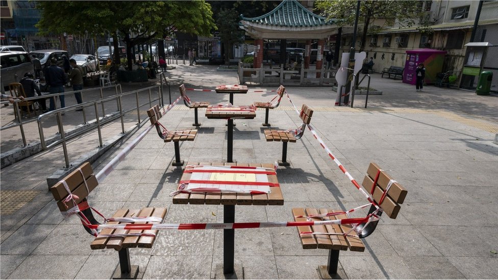 Recreational chess tables are seen taped to prohibit its use for the public at a playground in Hong Kong on January 7, 2022