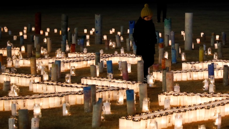 Velas em homenagem a mortos por terremoto de 2011
