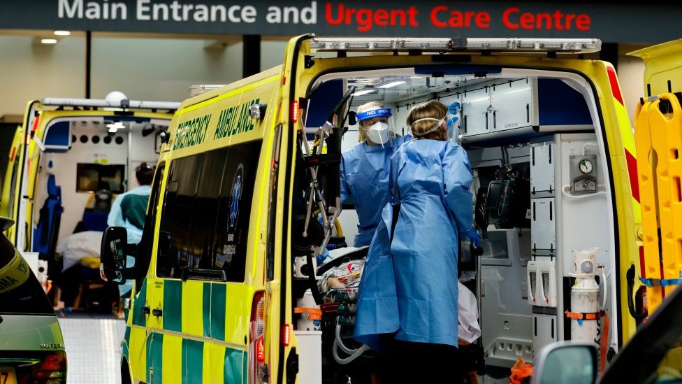 A patient is treated inside an ambulance at Guy's Hospital in central London on Tuesday