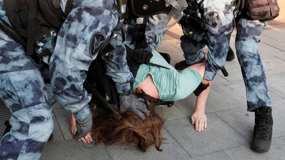 Police detain a protester in Moscow, 27 July
