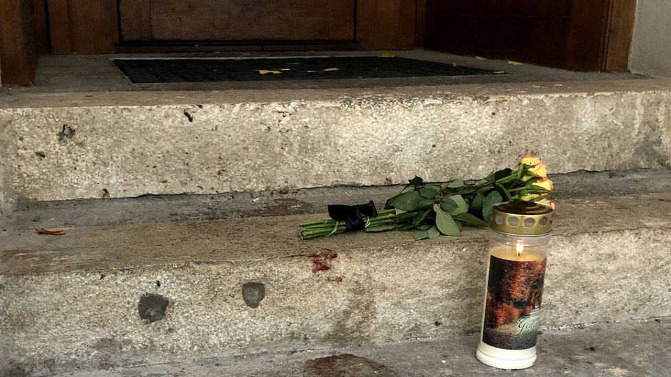 Candle and flowers on doorstep of Salzamt restaurant