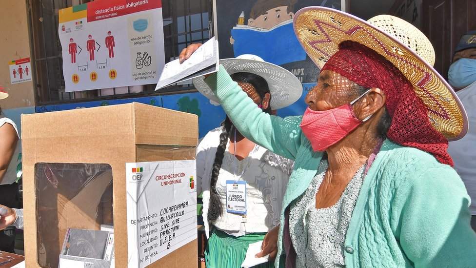 A Bolivian woman casts her ballot at the school Unidad educativa Eduardo Abaro in the village of Parotani some 50 km from Cochabamba, Bolivia, 18 October 2020