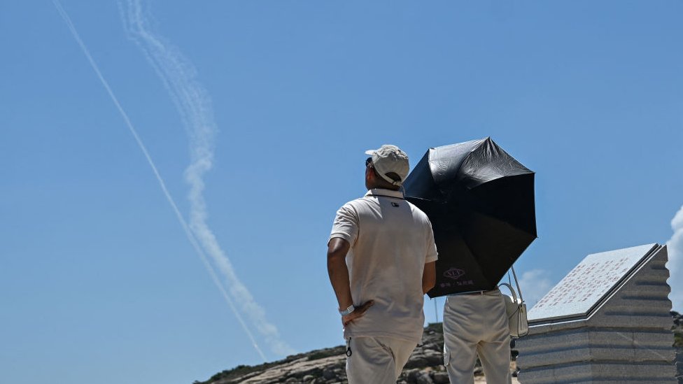 People watching missile trails from Taiwan coast