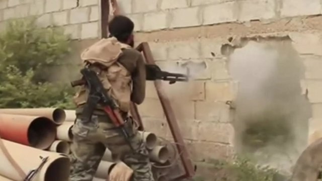 Fighter firing gun in Syria