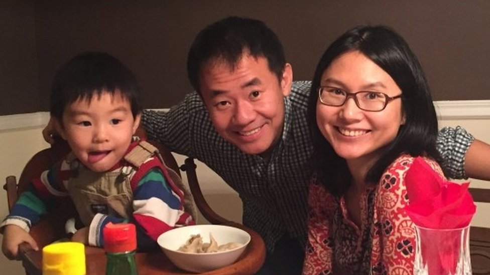Xiyue Wang (centre) with his wife and son (file picture)
