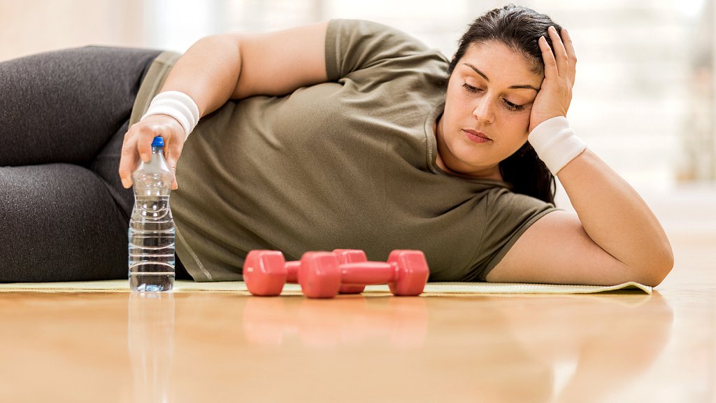 Girl looking at weights