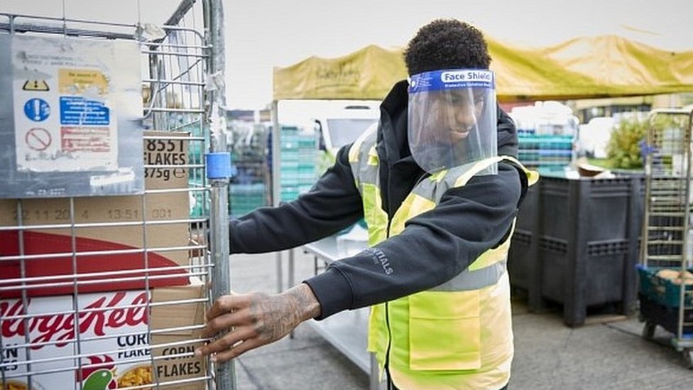 Footballer Marcus Rashford helping out at the FareShare food charity in Manchester