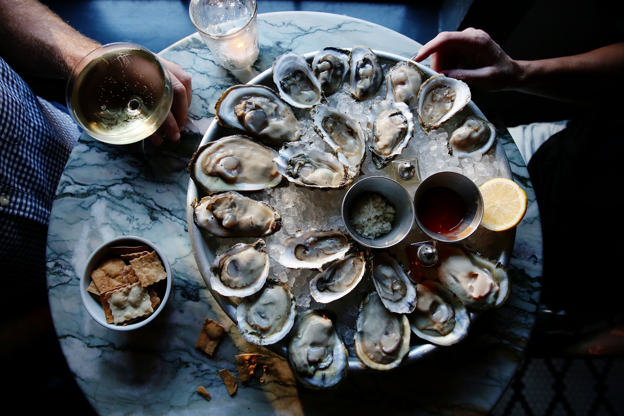 A platter of oysters on a table