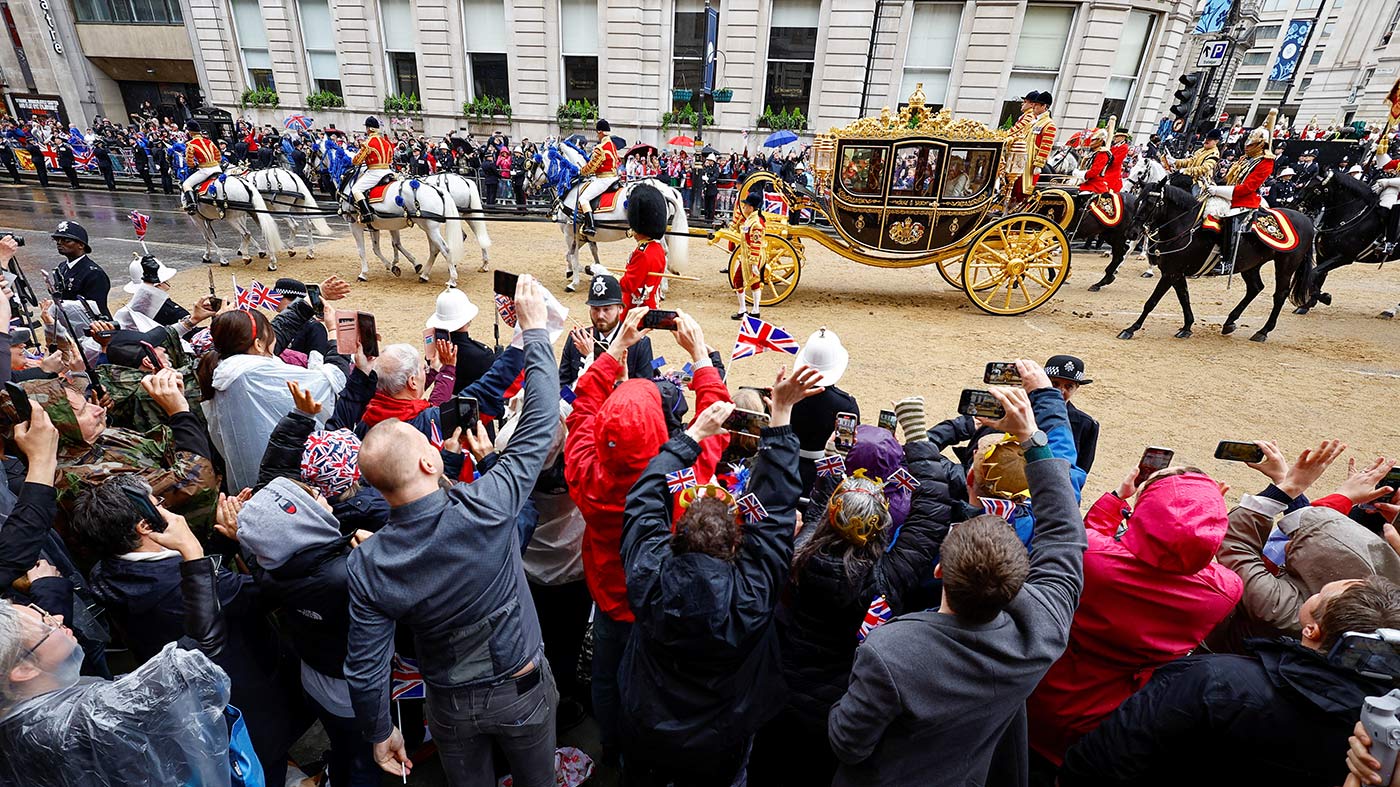 The procession leaves The Mall and turns on to Trafalgar Square