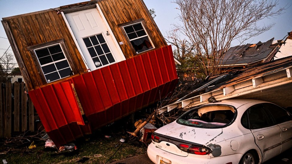 An ambulance arrives at Rolling Fork, Mississippi, which was devastated by a tornado, 25 March