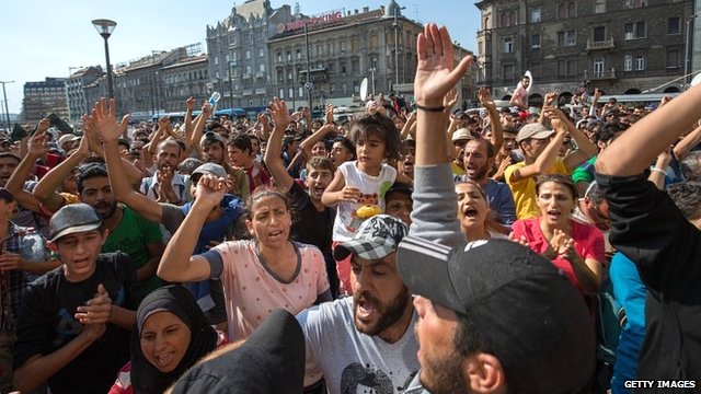 Migrants protest outside Keleti station in central Budapest after it was closed to migrants on 1 September 2015