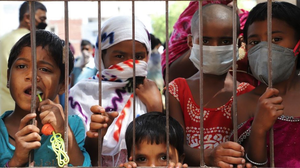 Kids in a slum area in Gurugram wearing masks as precautionary measures over the spread of the COVID-19 novel coronavirus on the outskirts of New Delhi, India on 24 April 2020.