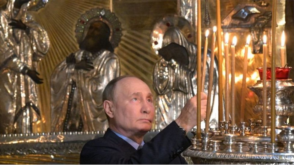Vladimir Putin, pictured in a cathedral on Wednesday