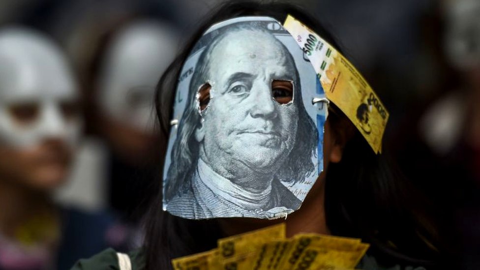 Demonstration in Argentina.  person with a dollar in the face in Argentina.