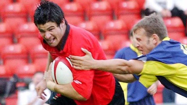 Mike Phillips takes on Romania on his Wales debut in 2003