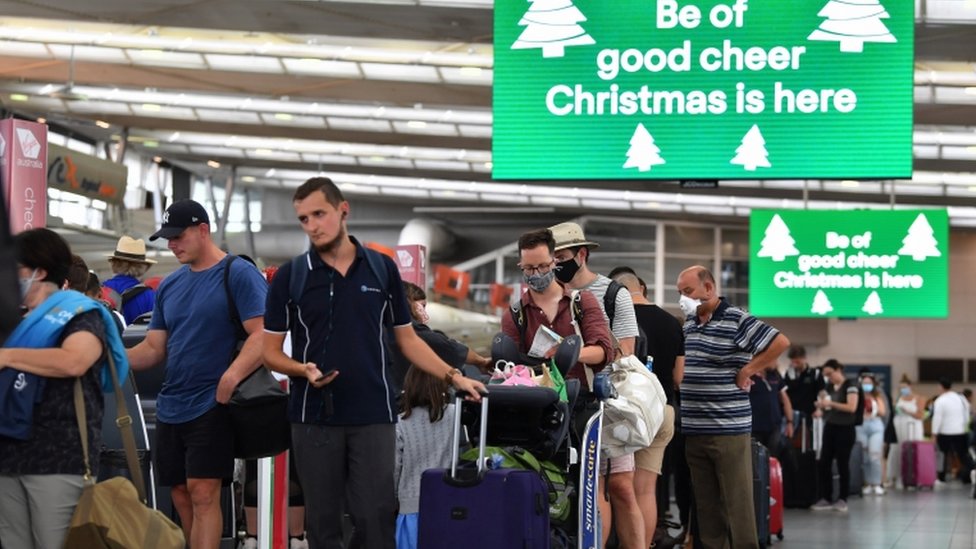 Long lines of passengers are seen trying to depart Sydney Domestic Airport in Sydney, Australia