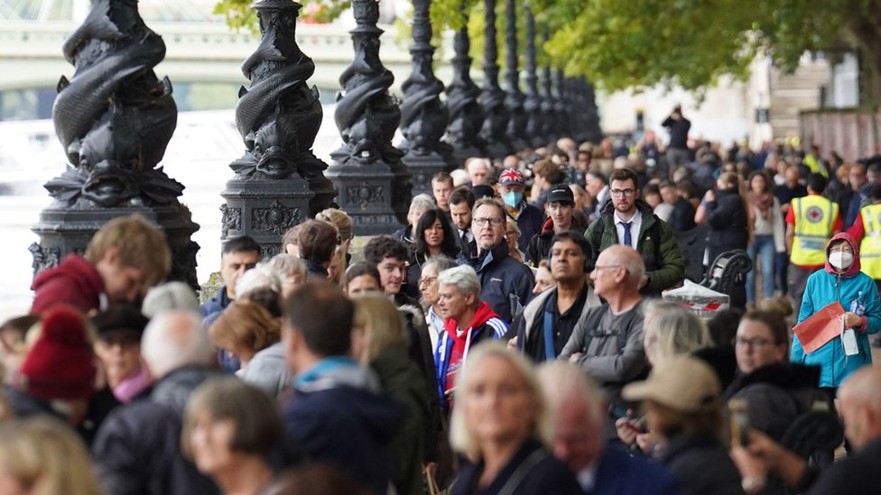 Members of the public join the queue on the South Bank, as they wait to view Queen Elizabeth II lying in state, 14th September 2022