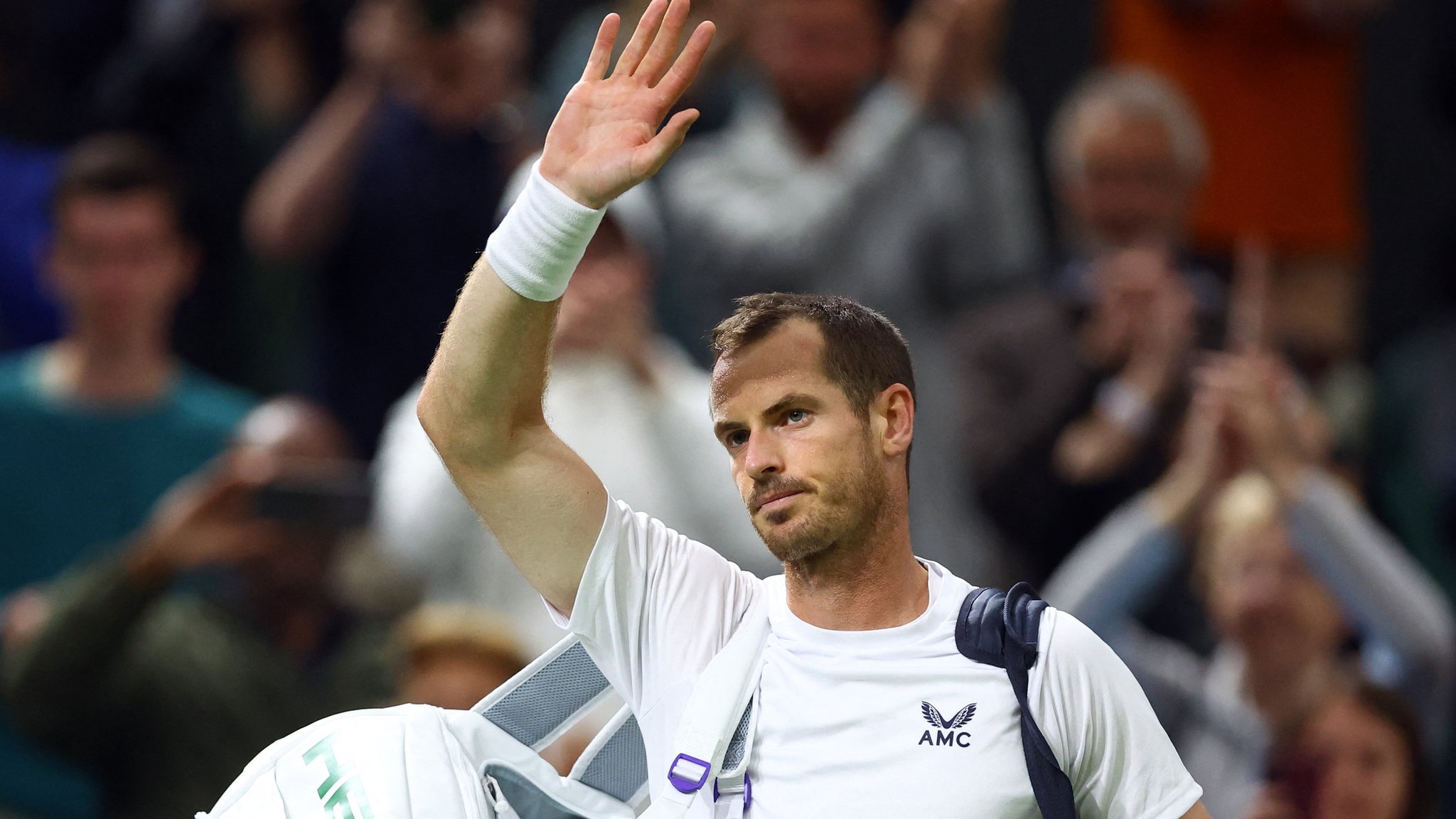 Wimbledon: Britain's Andy Murray knocked out in second round by John Isner