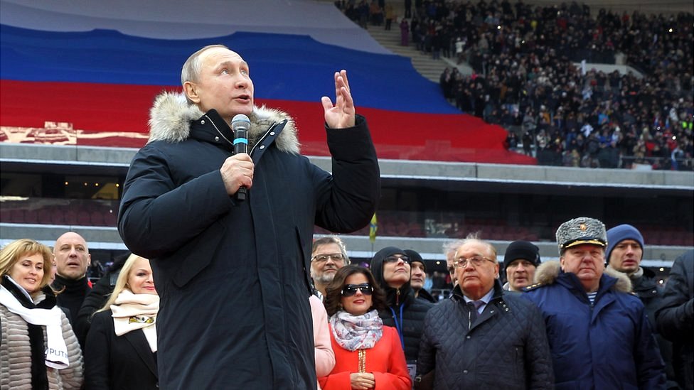 Russian President Vladimir Putin speaks during a campaign concert in March 2018
