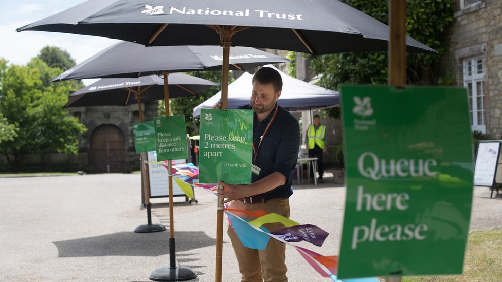 Signage at the National Trust's Petworth House, West Sussex, as it welcomes back visitors following the coronavirus lockdown